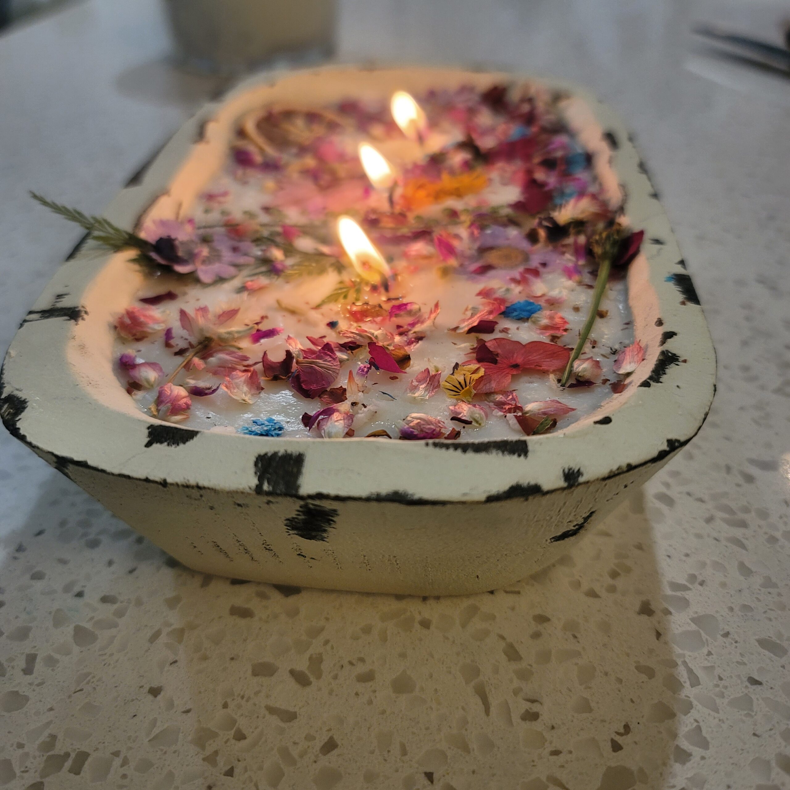 A lit candle made at the first Be A Light gathering